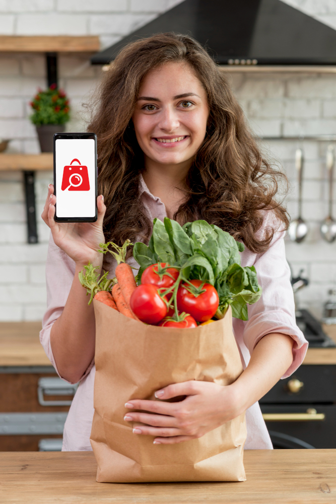 ne utilisatrice de l'application Reprice consulte les offres spéciales dans son supermarché préféré pour le comparer.